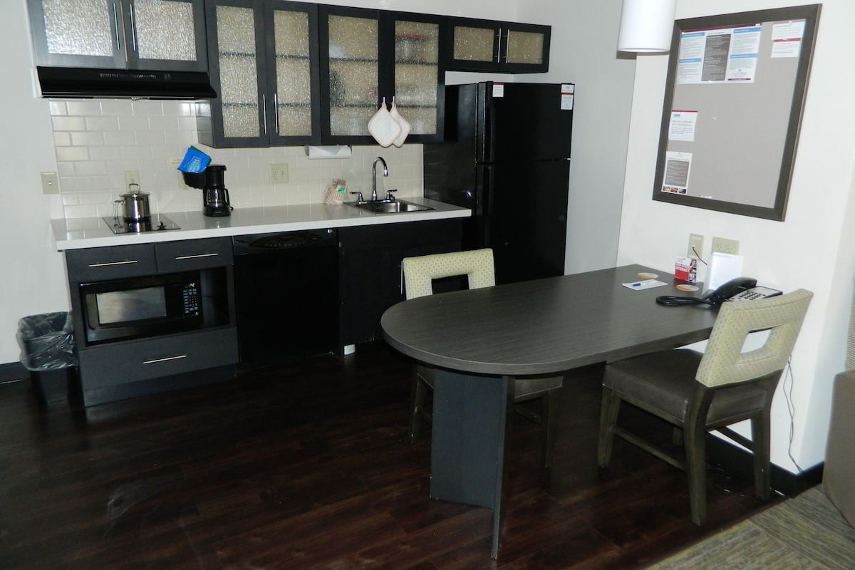 full-sized fridge, microwave, stovetop, dishwasher