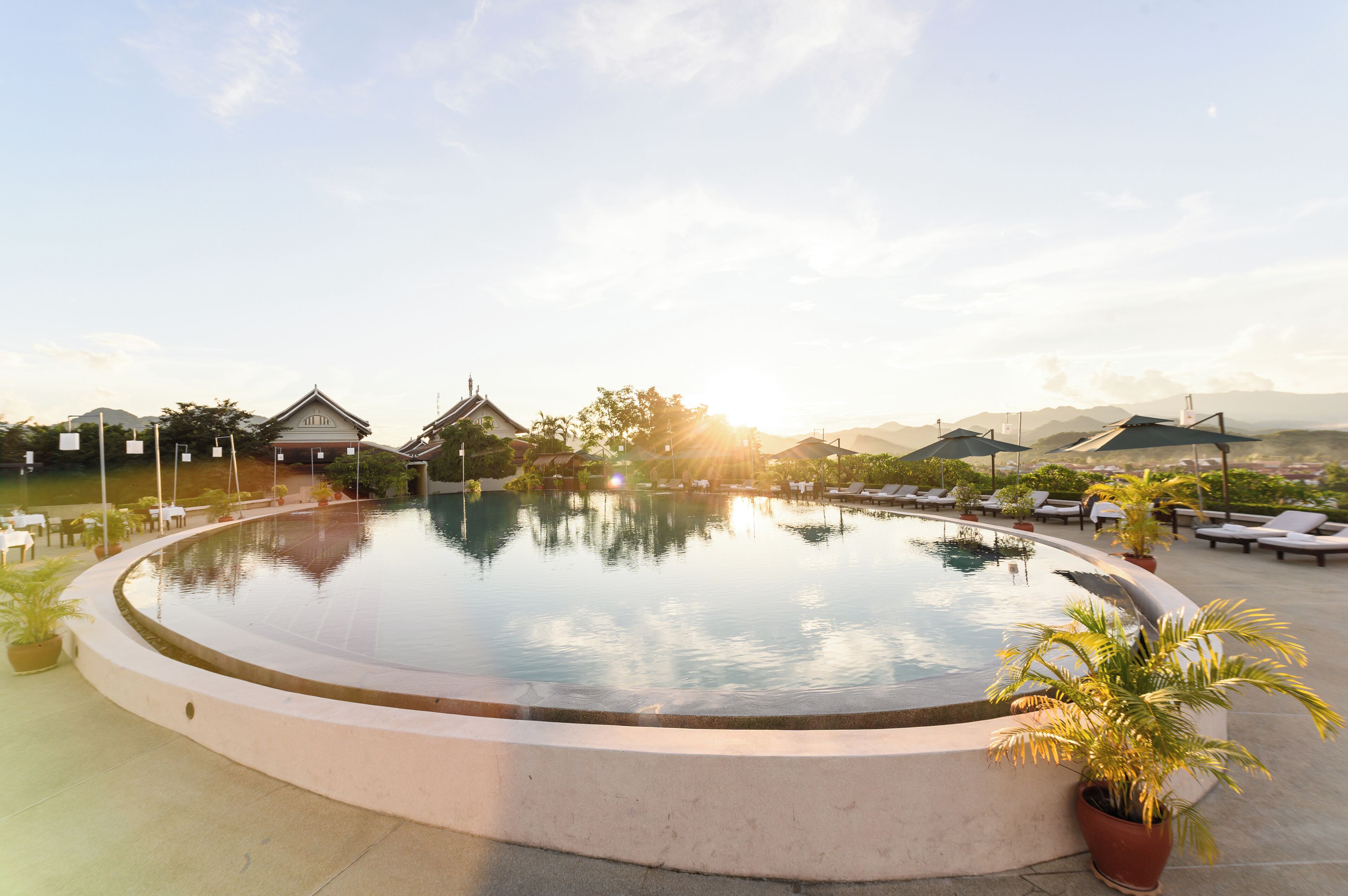 Outdoor pool, pool umbrellas, sun loungers