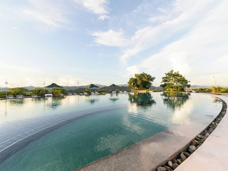 Outdoor pool, pool umbrellas, sun loungers