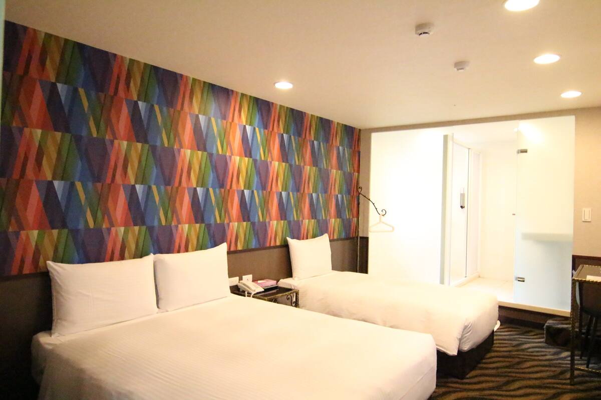Triple Room | Down comforters, in-room safe, desk, blackout drapes