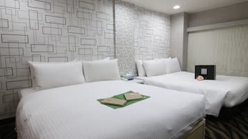 Quadruple Room | Down comforters, in-room safe, desk, blackout drapes