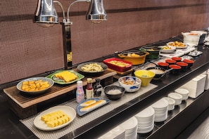 A buffet with various dishes and condiments. - Hiroshima Washington Hotel (Hiroshima)