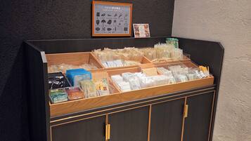 A reception desk with a framed menu and a variety of items on display.