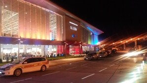 A large, modern building with a prominent sign reading "ELAS". - Casa Fusión (La Paz)