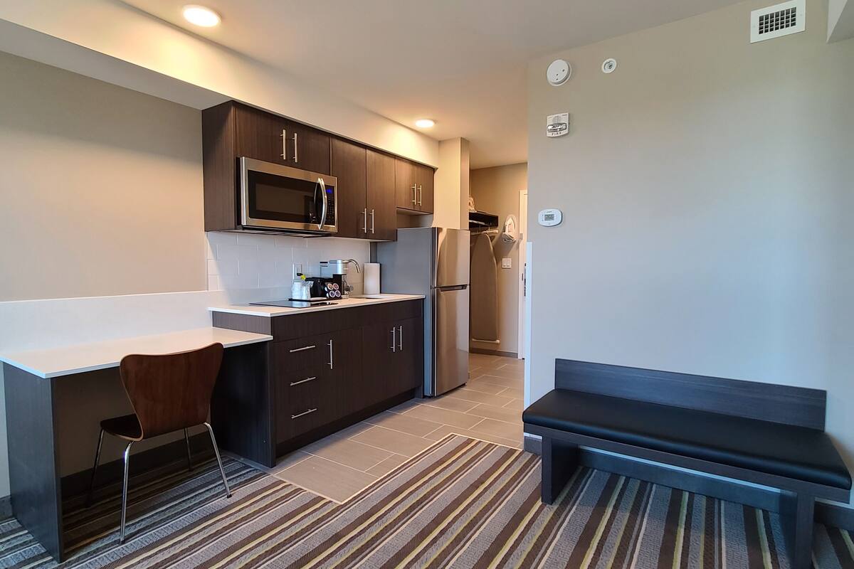 suite, 1 bedroom, non smoking | blackout curtains, iron/ironing board, free cots/infant beds