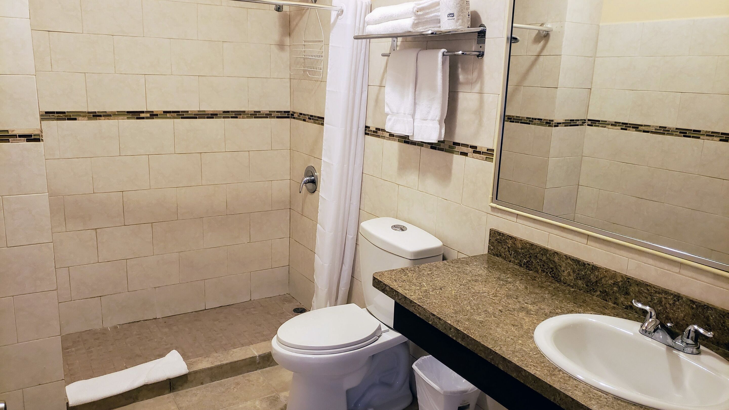 honeymoon suite | bathroom | bathtub, free toiletries, hair dryer, towels