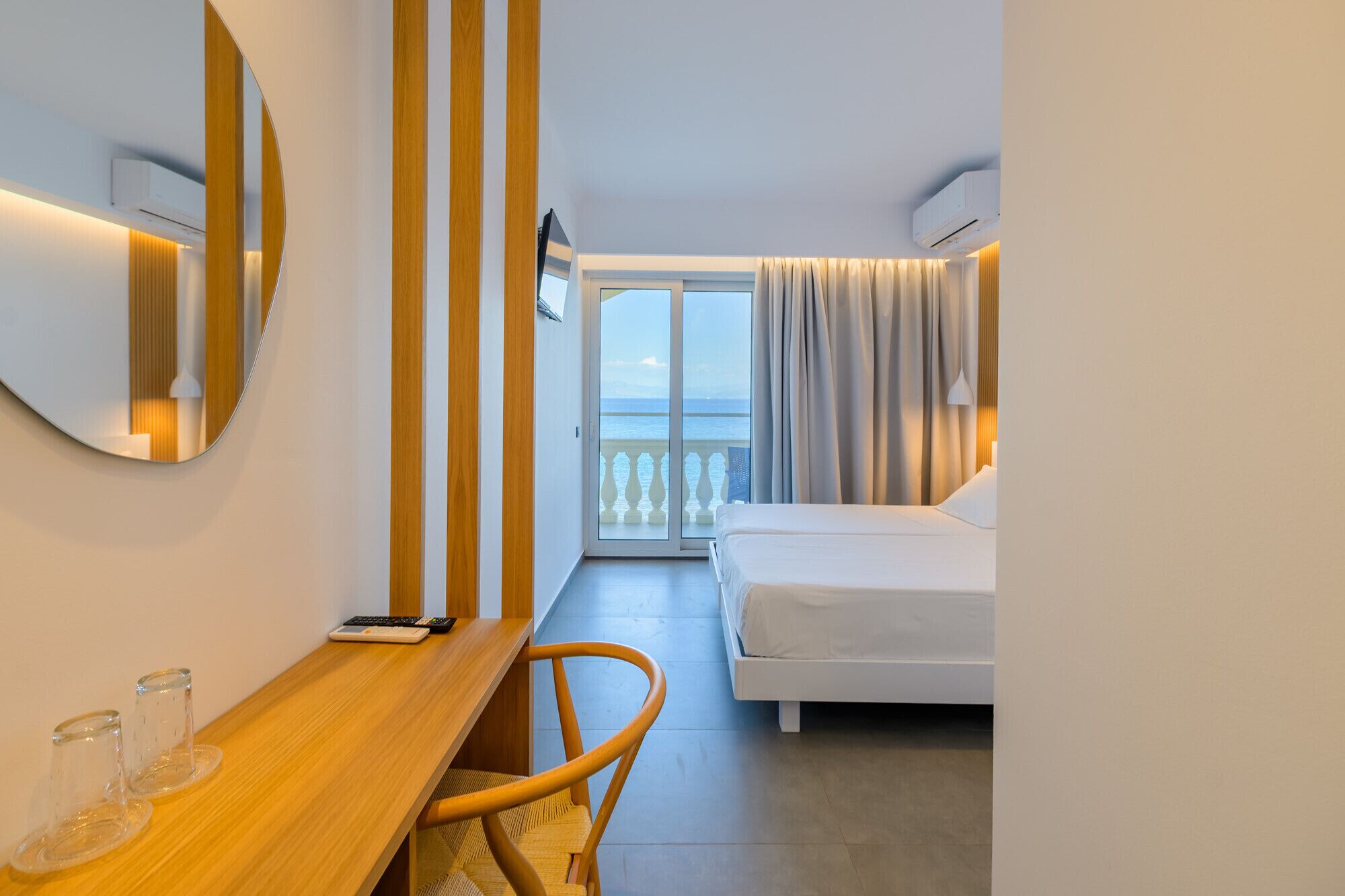 superior deluxe double or twin room with balcony and pontikonisi island view | 1 bedroom, minibar, in-room safe, blackout curtains