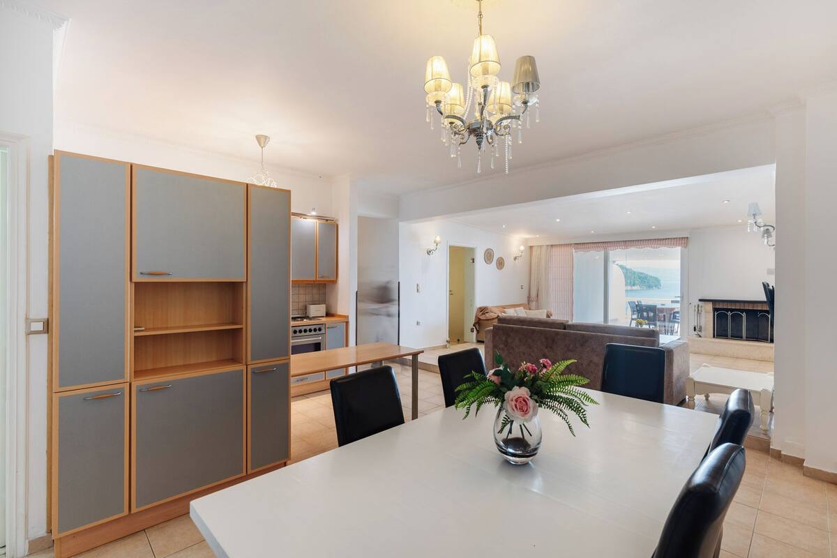 superior suite with private terrace and pontikonisi island view | private kitchen | fridge