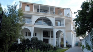 A two-story building with a central courtyard, arched windows, and balconies. - 66 Residency - A Boutique Hotel (Jaipur)