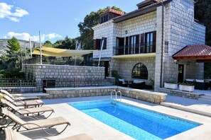 Outdoor pool, pool umbrellas, pool loungers