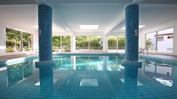 Indoor pool, seasonal outdoor pool, pool umbrellas, pool loungers