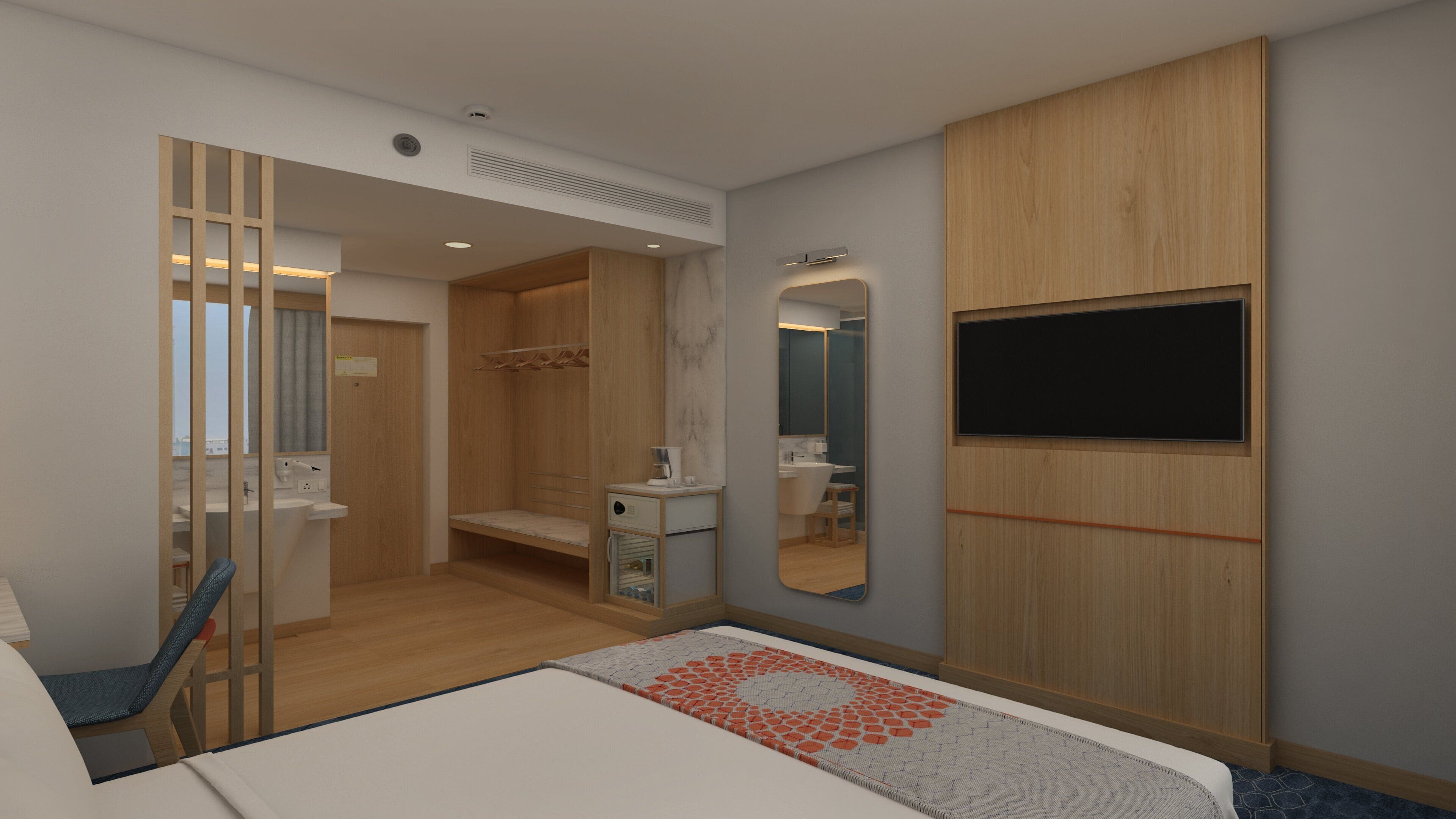 A modern hotel room with a bed, a desk, a mirror, and a TV.