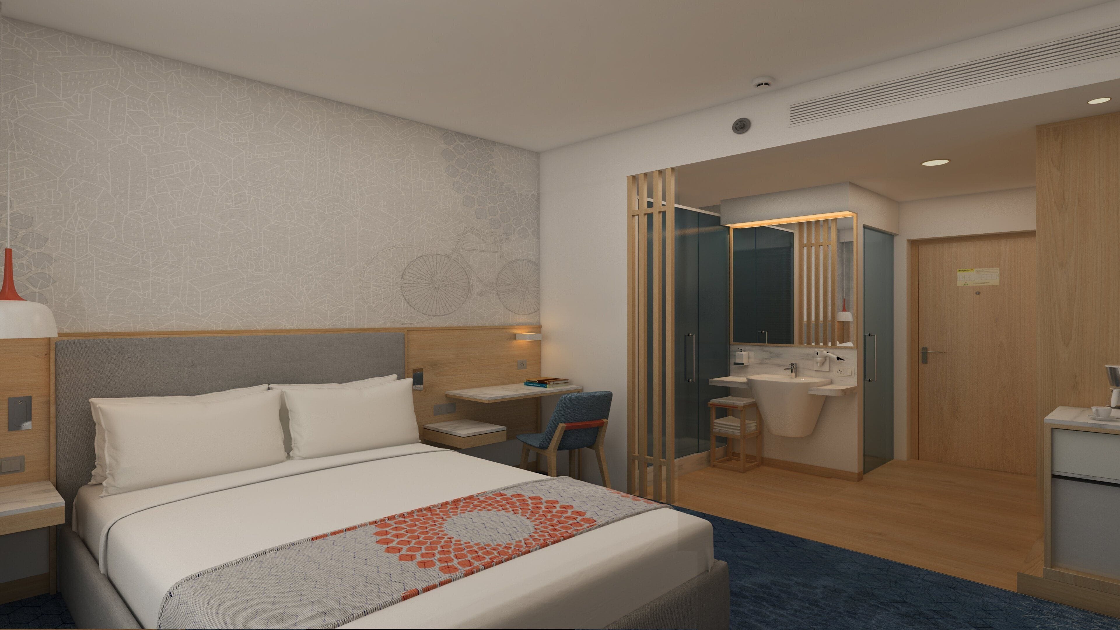 A hotel room with a bed, a desk, a chair, a bathroom, and a wardrobe.