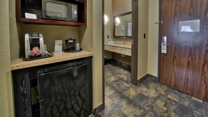 A kitchenette with a microwave, coffee maker, and a small refrigerator. - Holiday Inn Express Hotel & Suites Lubbock South by IHG (Lubbock)