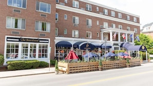 A brick building with a restaurant named 'J. Morgans' and a sign for 'The Boardroom'.