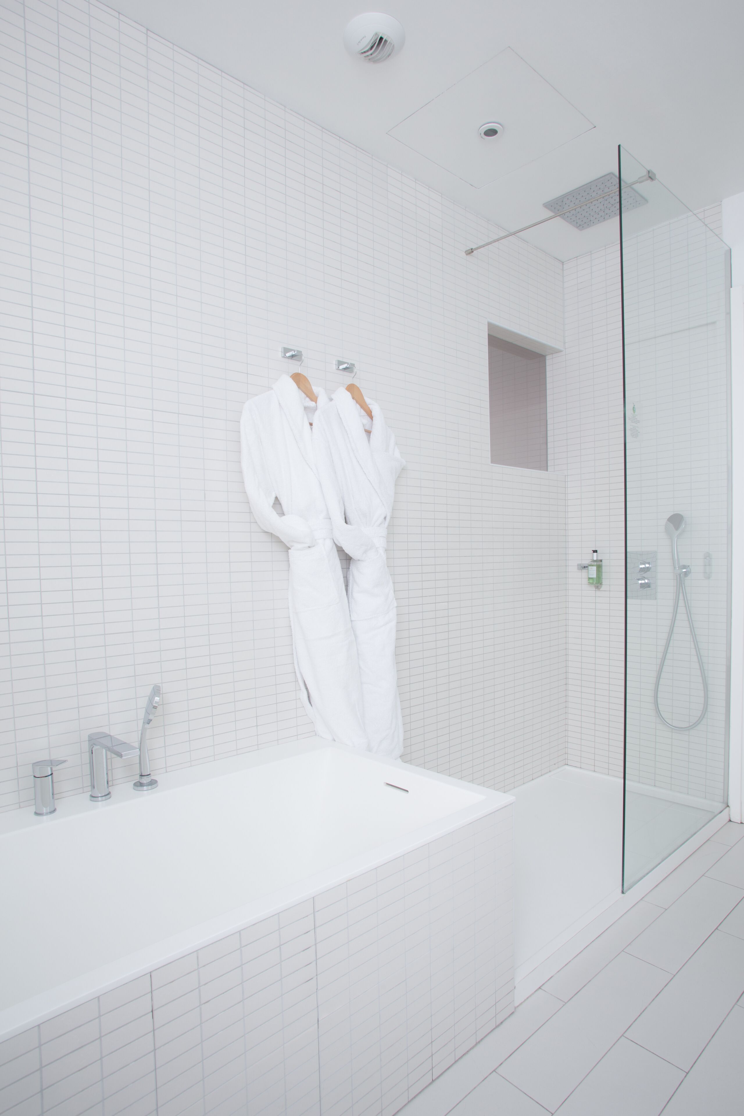 junior suite | bathroom | hair dryer, bathrobes, slippers, towels