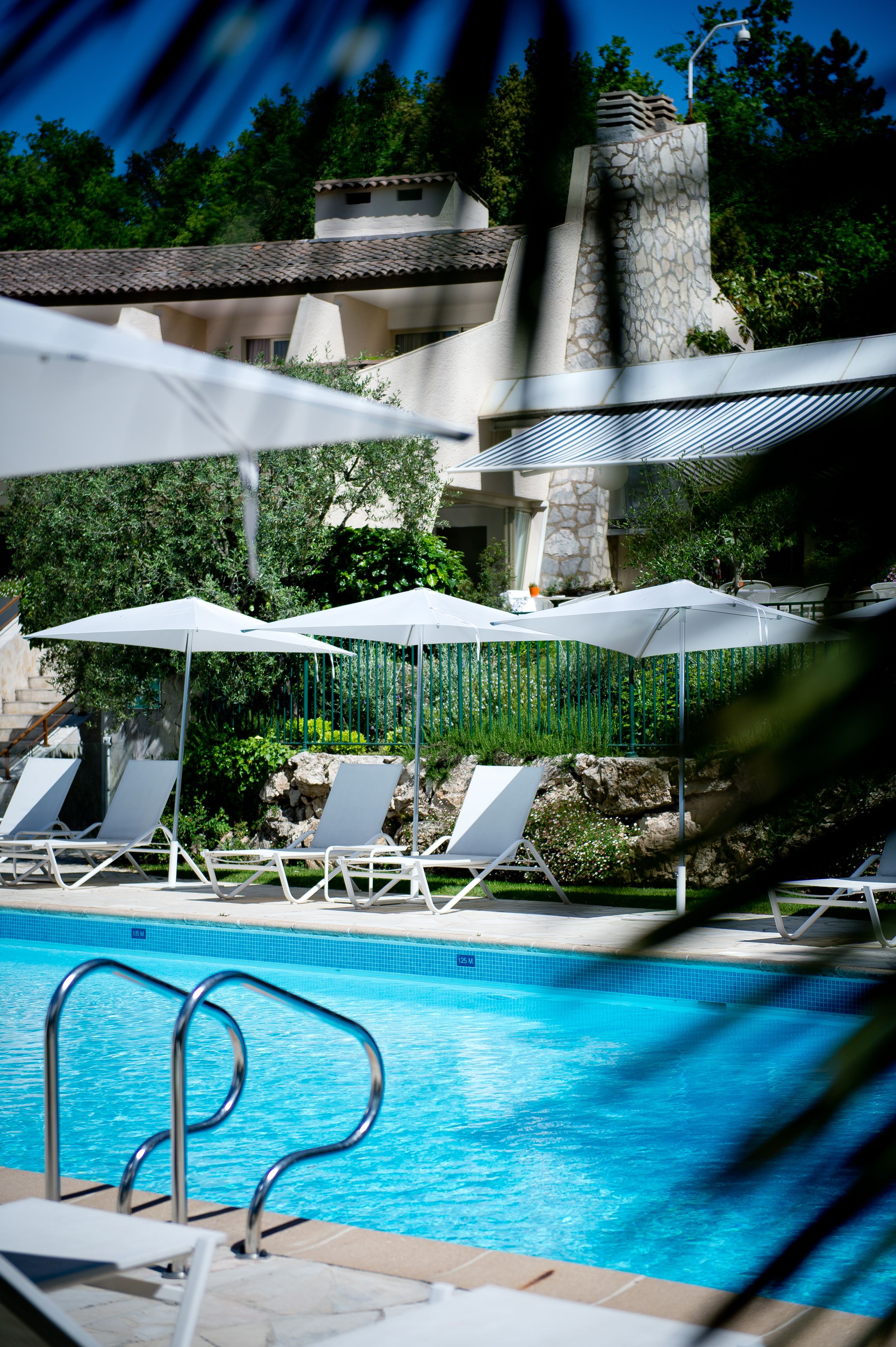 seasonal outdoor pool, open 9:00 am to 8:00 pm, pool umbrellas