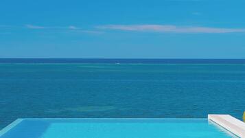 2 outdoor pools, pool umbrellas, pool loungers