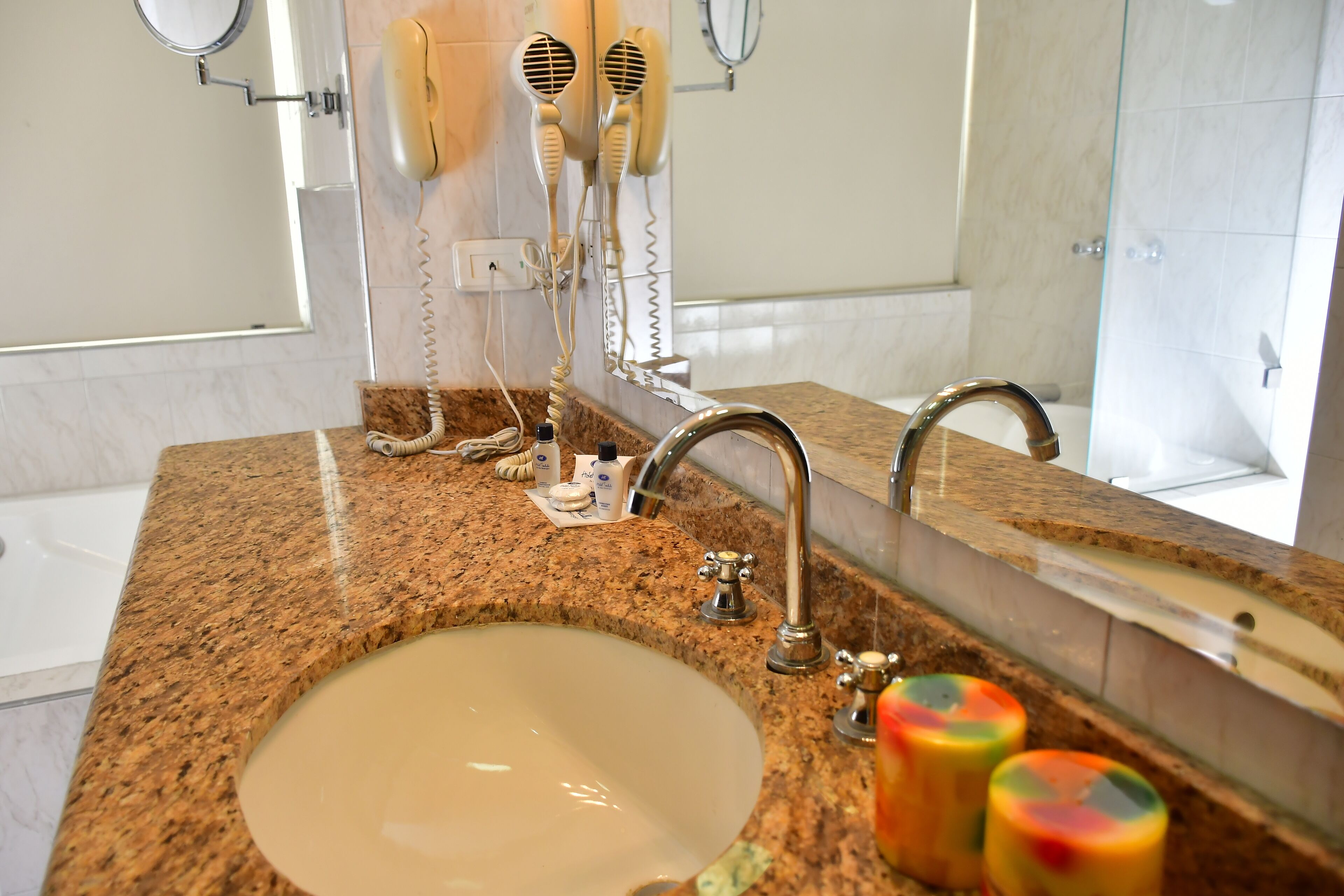 designer toiletries, hair dryer, bidet, towels