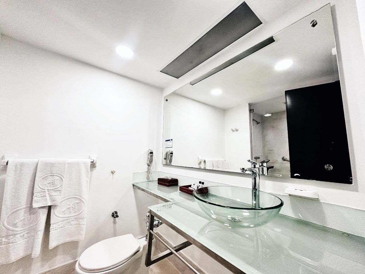 designer toiletries, hair dryer, bidet, towels