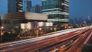 A modern skyscraper with illuminated windows and a prominent 'Shangri-La' sign. - Jing An Shangri-La, Shanghai (Shanghai)
