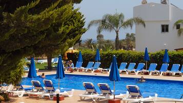 Seasonal outdoor pool, pool umbrellas, pool loungers