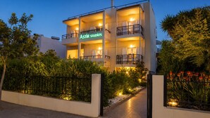A multi-story building with balconies and a sign reading 'ASTR STUDIOS'. - Astir Studios (Hersonissos)