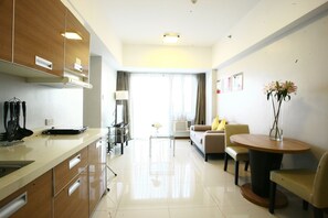 One Bedroom Suite ( 2 Breakfast and Spa Ticket - Adult Only ) | Living area | 32-inch LED TV with cable channels, TV - Ace Hotel & Suites (Pasig)