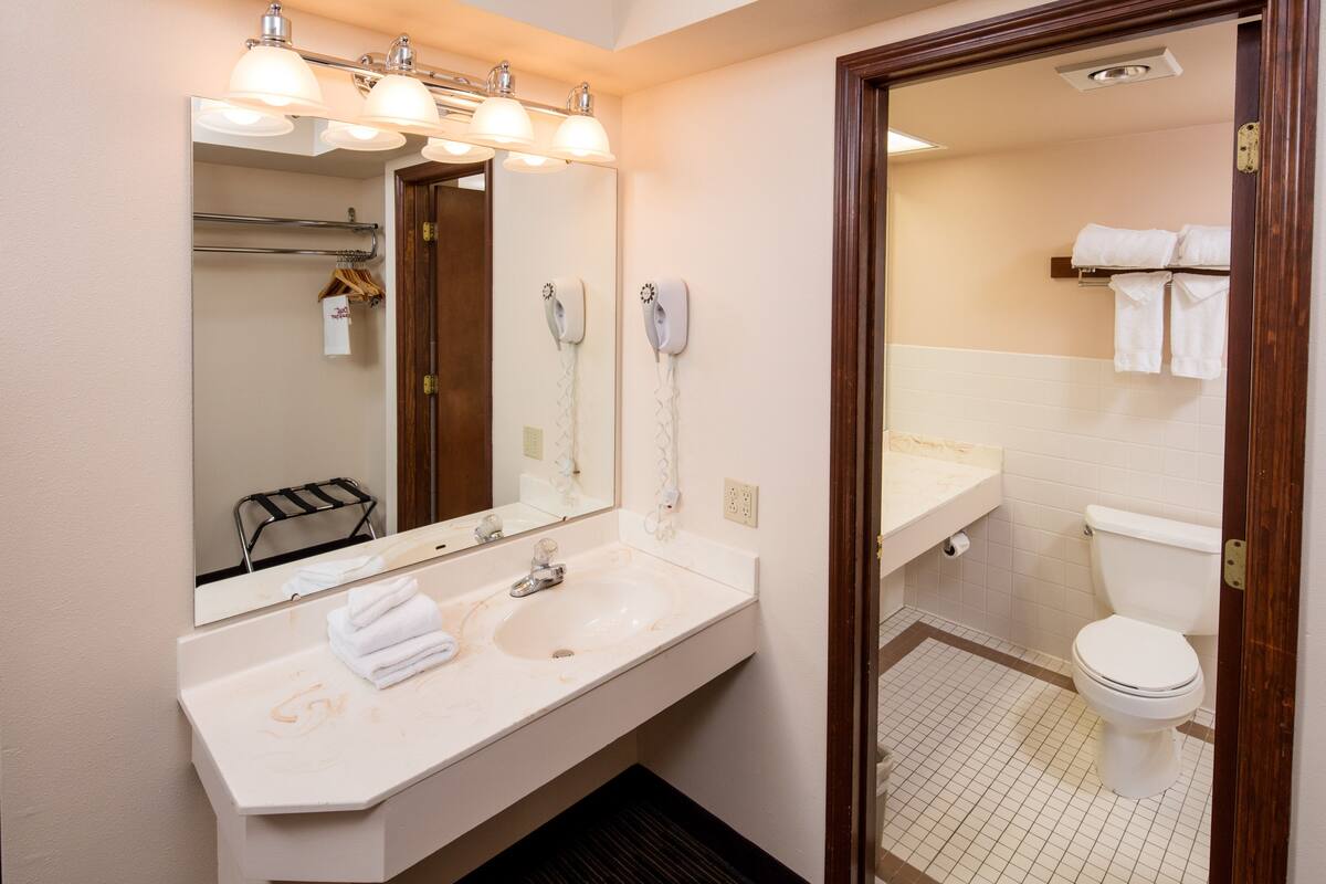 premium room, 2 queen beds | bathroom | combined shower/bathtub, free toiletries, hair dryer, towels