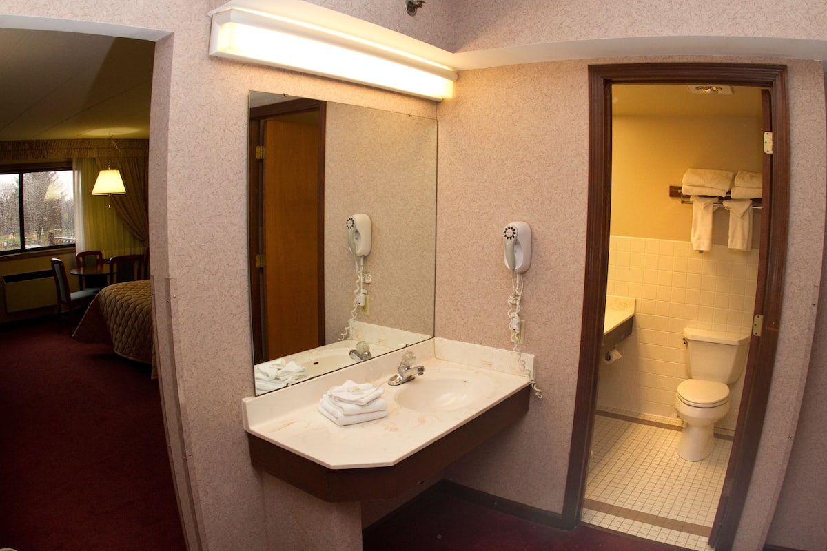 premium room, 2 queen beds | bathroom | combined shower/bathtub, free toiletries, hair dryer, towels