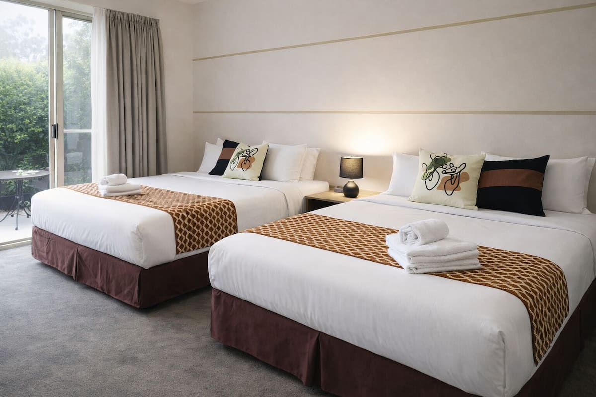 Twin Double Room | Individually decorated, individually furnished, blackout drapes