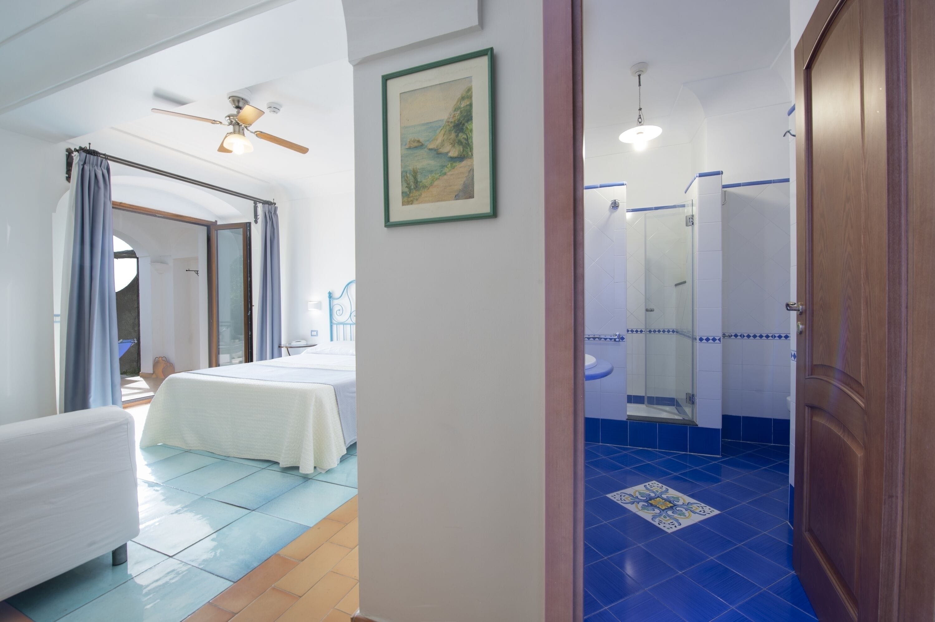 deluxe double room, patio, sea view | individually decorated, individually furnished, desk, blackout curtains