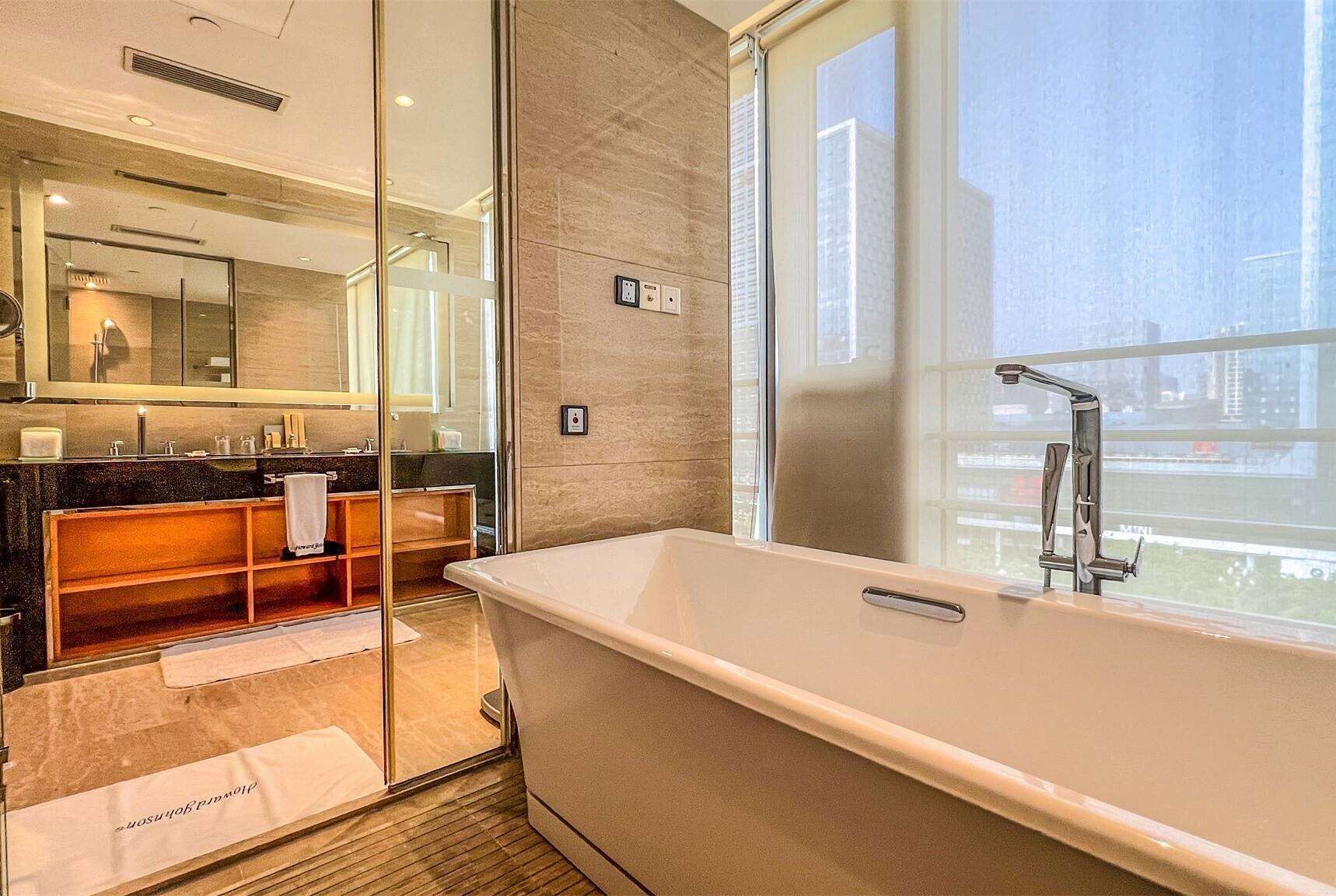 separate bathtub and shower, deep-soaking bathtub, rainfall showerhead