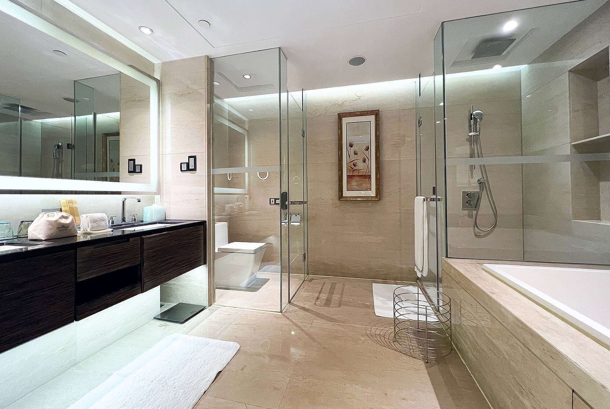 separate bathtub and shower, deep-soaking bathtub, rainfall showerhead