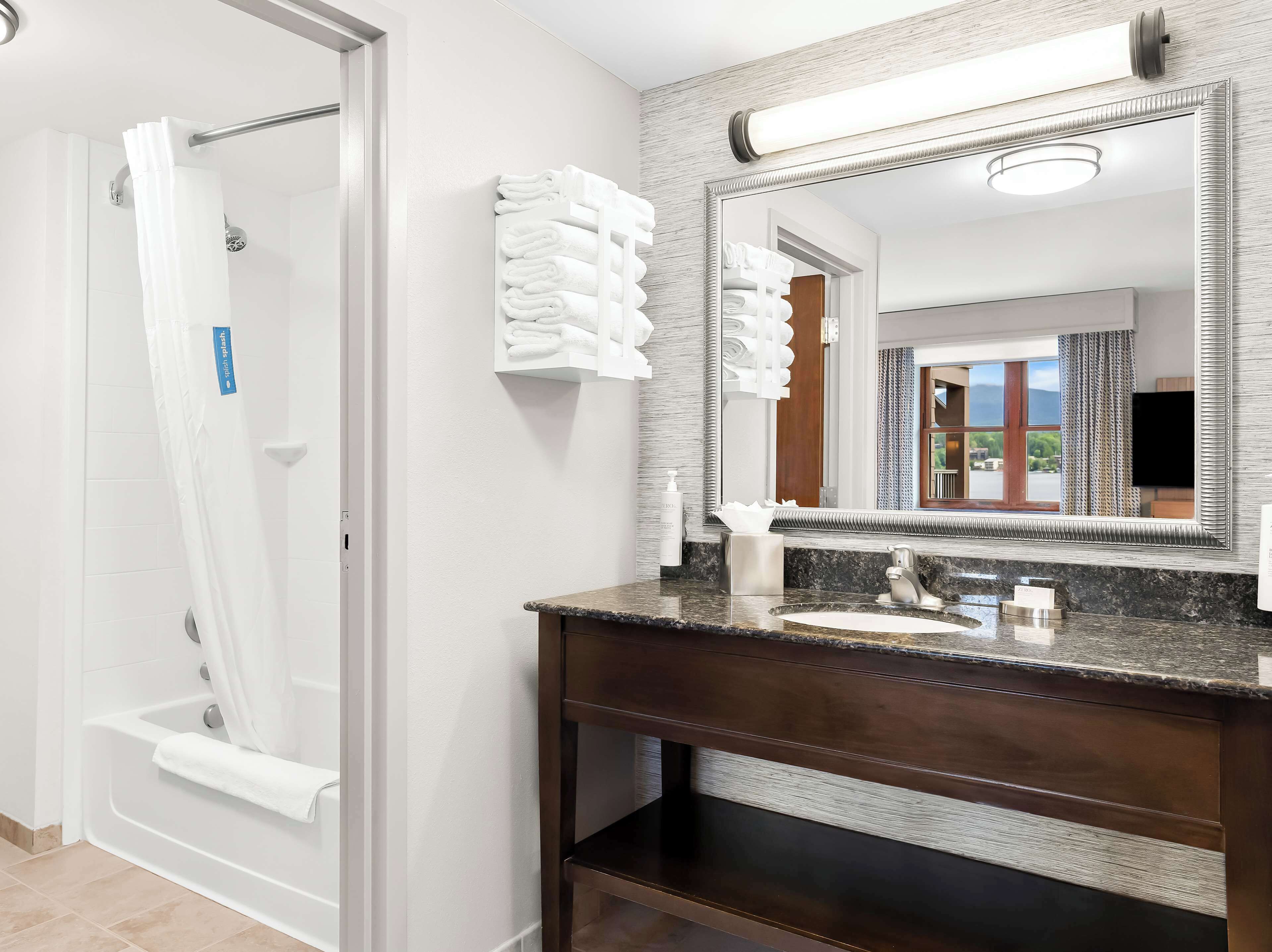 suite, one king bed | bathroom | combined shower/bathtub, free toiletries, towels