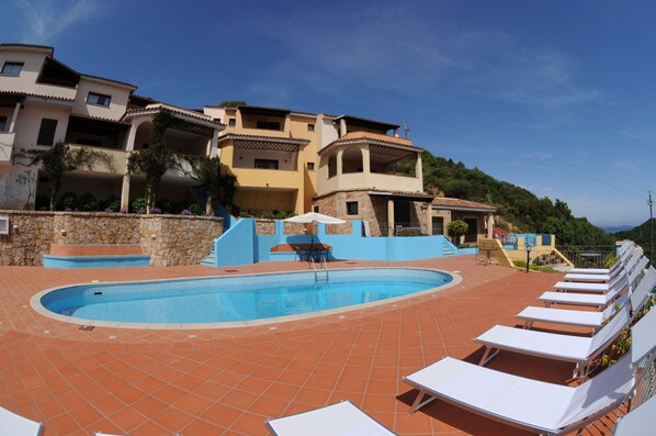 Seasonal outdoor pool, open 10:00 AM to 8:00 PM, pool umbrellas