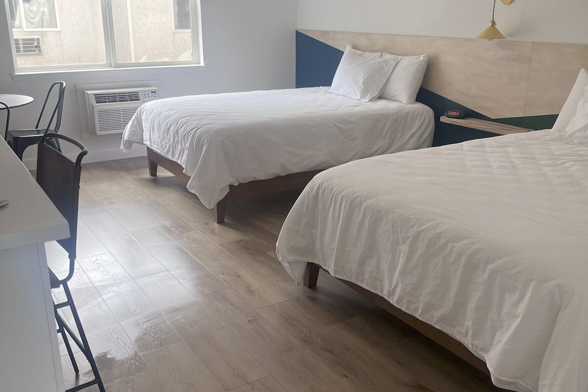 Standard Room, 2 Queen Beds | Desk, laptop workspace, iron/ironing board, free WiFi
