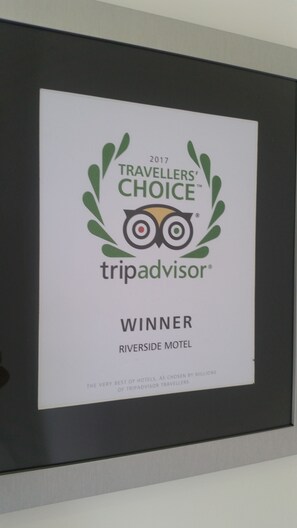 A framed award certificate for the 2017 Travellers' Choice winner, Riverside Motel.