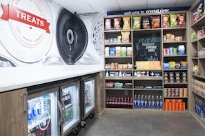 A snack and beverage section with shelves stocked with chips, snacks, and bottled drinks. - Hampton Inn Crystal River, FL (Crystal River)