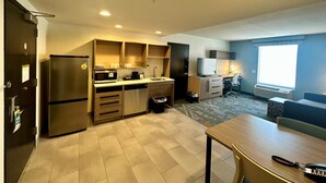 A compact kitchen with a refrigerator, microwave, and sink. - Home2 Suites by Hilton Rahway, NJ (Rahway)