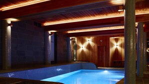 An indoor swimming pool with a wooden ceiling and tiled walls. - Astra Falls Creek (Falls Creek)