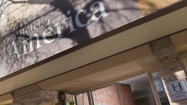 A hotel sign with the name 'Hotel America'. - Hotel América (Mendoza)