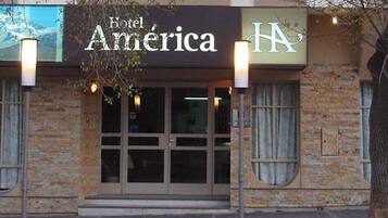 A building with a sign reading "Hotel America."