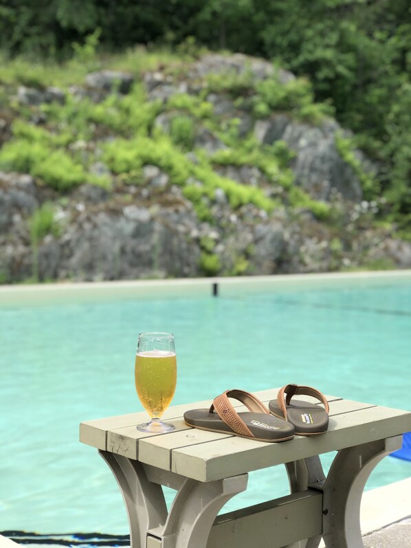 Seasonal outdoor pool, open 8:00 AM to 8:00 PM, pool umbrellas