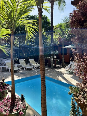 Outdoor pool, pool umbrellas, sun loungers