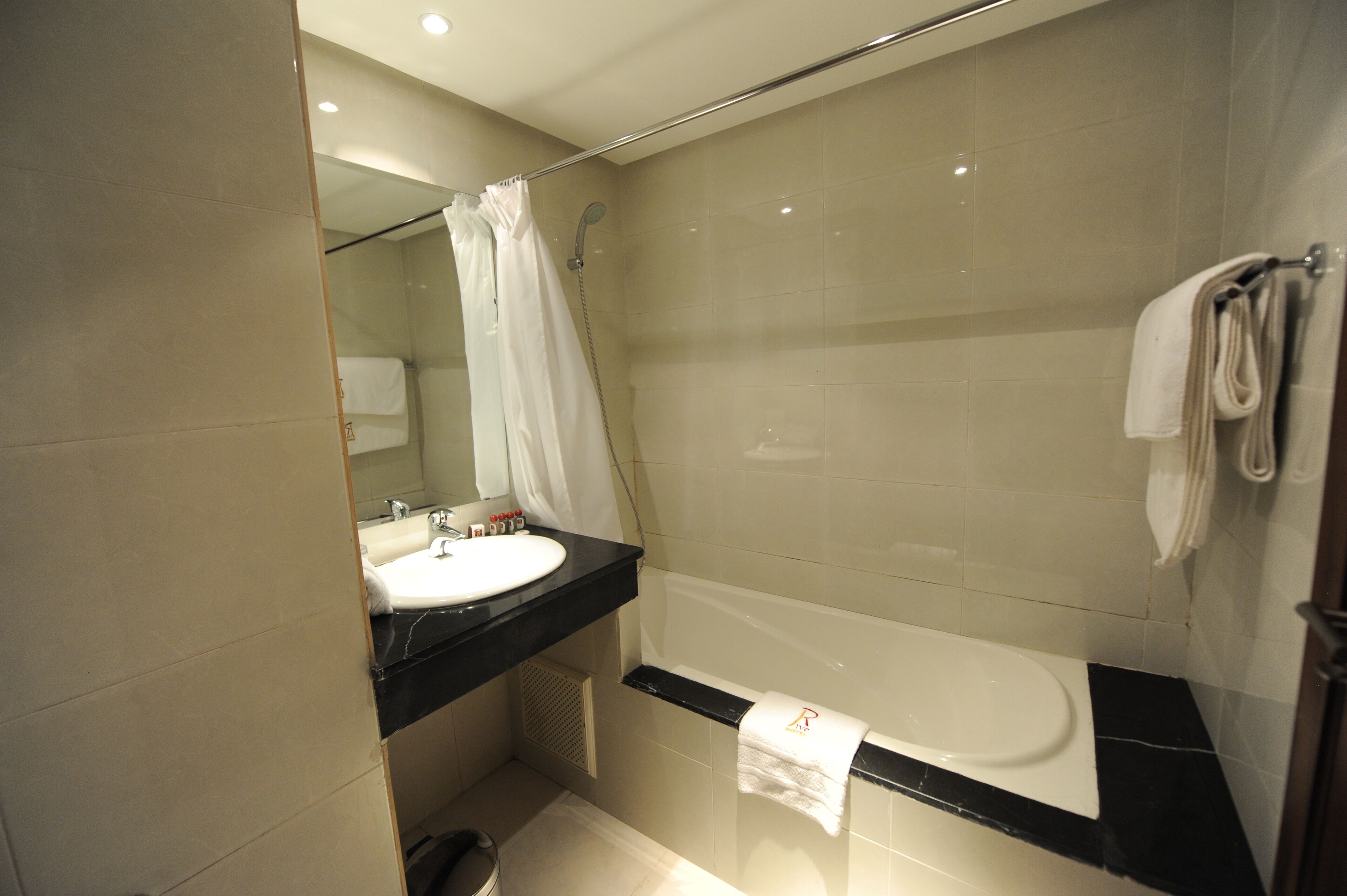 single room | bathroom | deep-soaking bathtub, rainfall showerhead, free toiletries, hair dryer