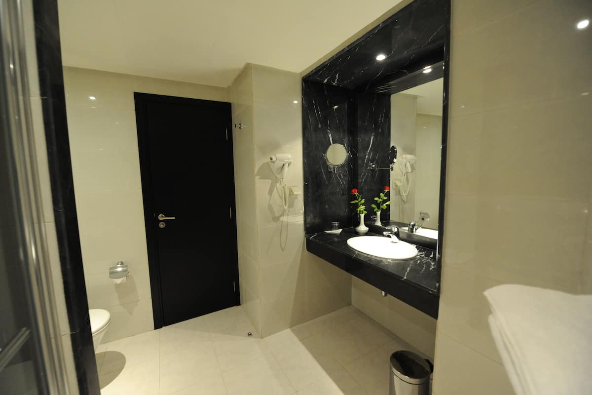 deep-soaking bathtub, rainfall showerhead, free toiletries, hair dryer