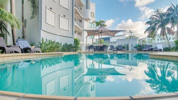 Outdoor pool, open 7:00 AM to 9:00 PM, pool umbrellas, pool loungers