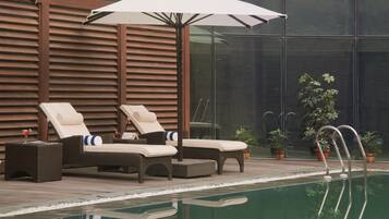 Seasonal outdoor pool, open 7 AM to 7 PM, sun loungers