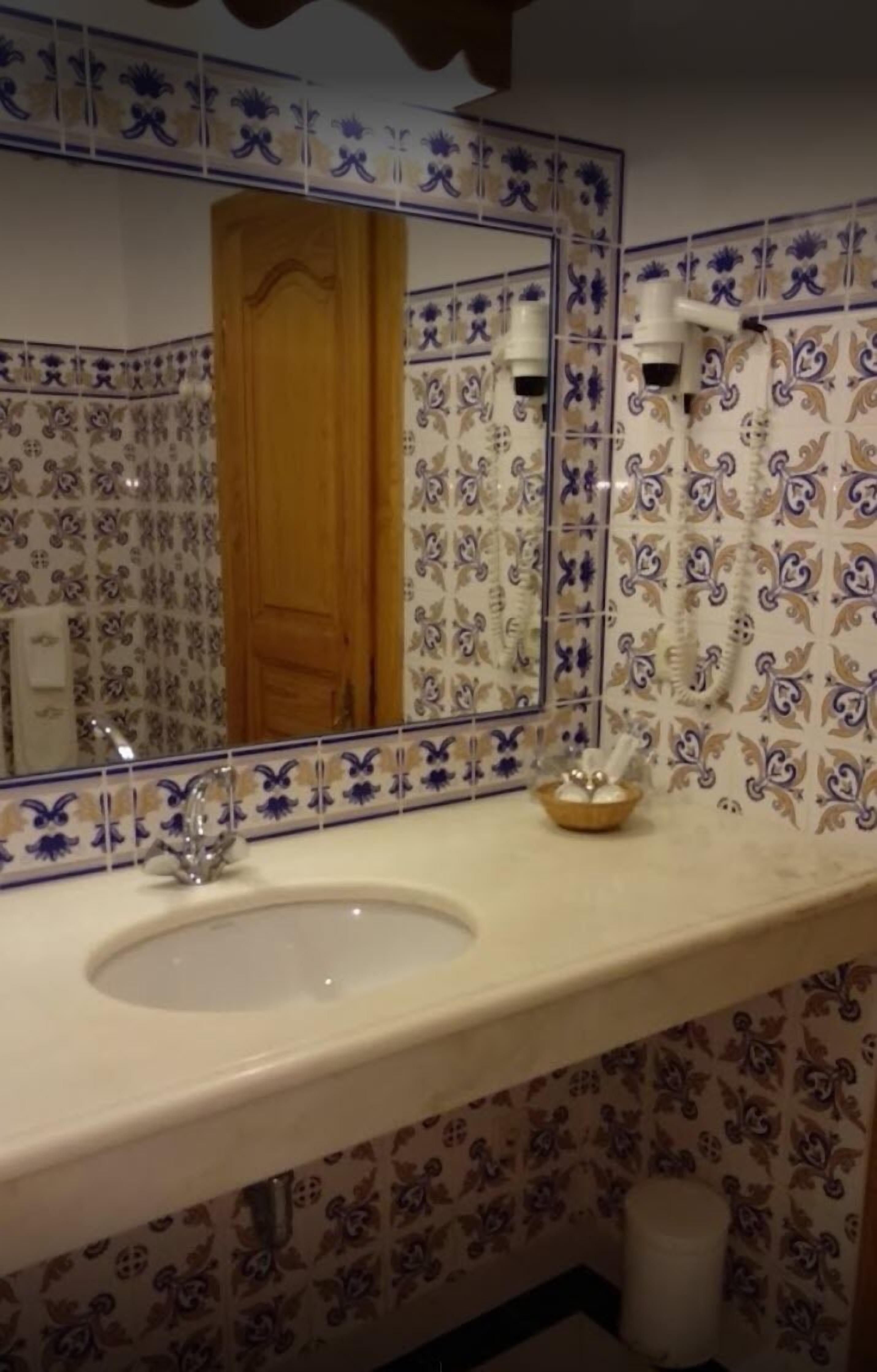 bathtub, hair dryer, towels